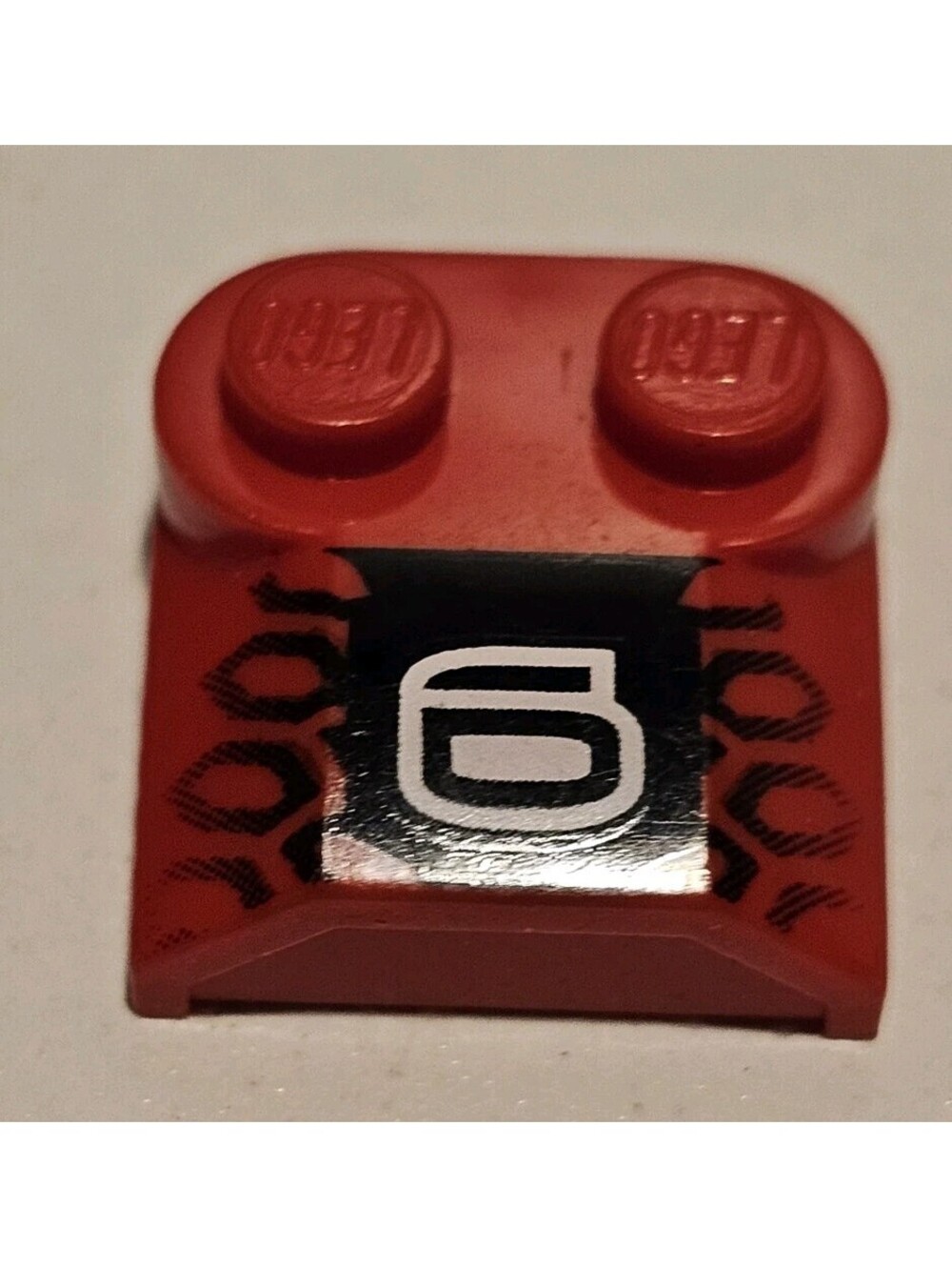 Lego 1 Red 2x2 sloped brick with printed design car truck